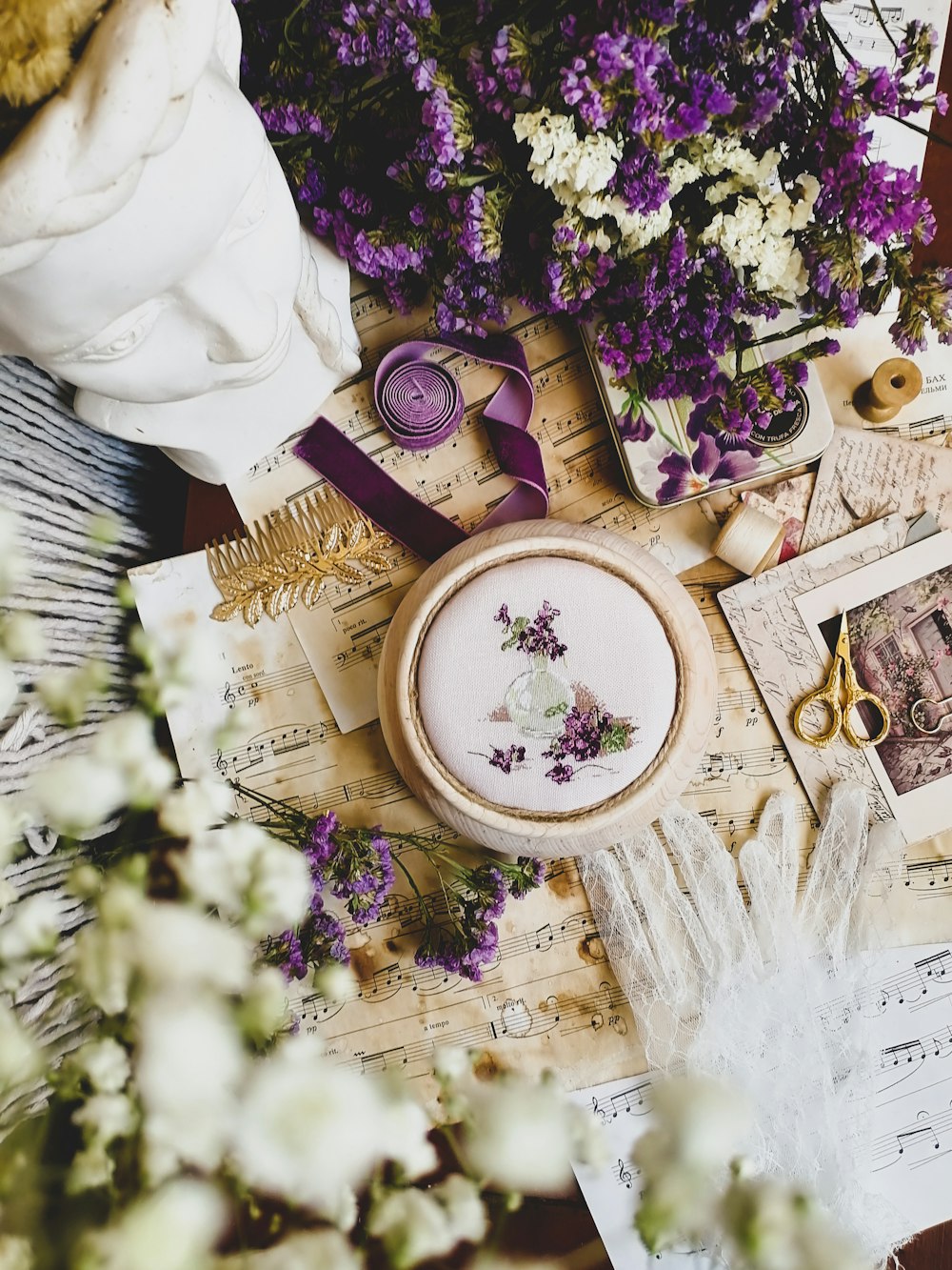 a table topped with lots of different types of flowers