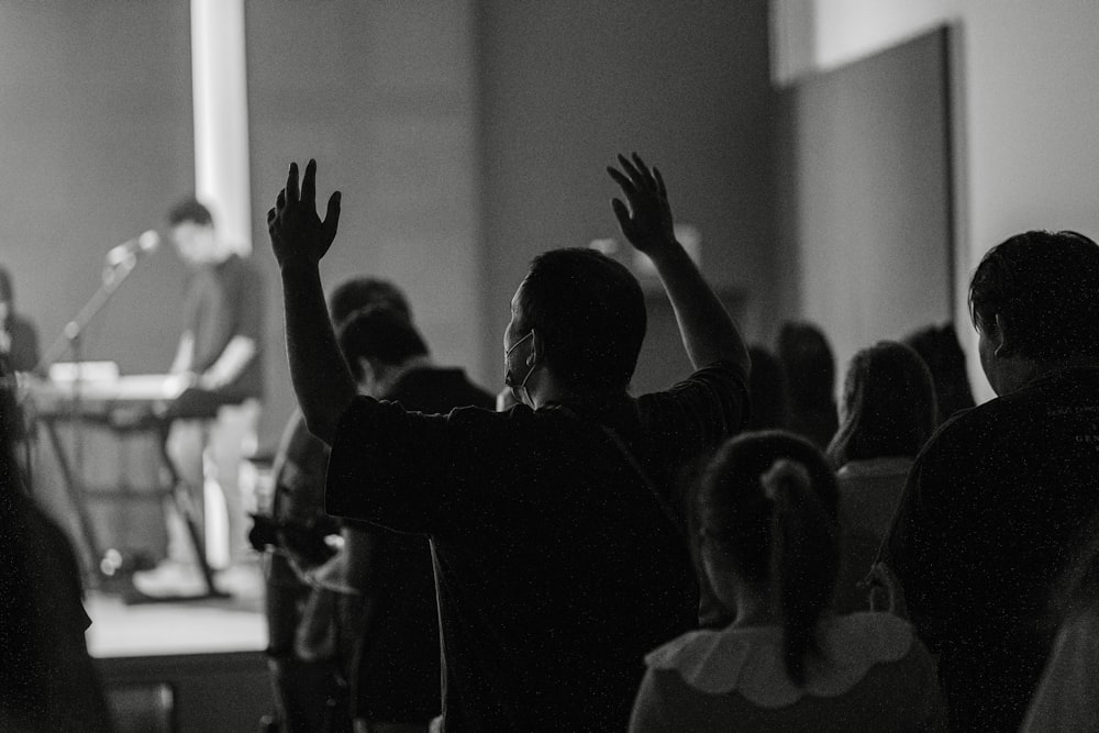 a man standing in front of a crowd of people