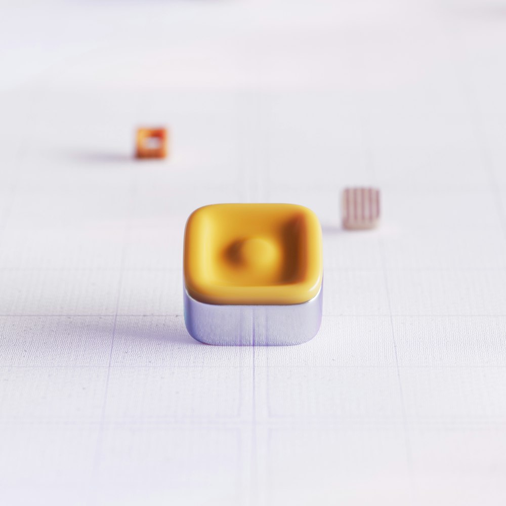 a square object sitting on top of a white table