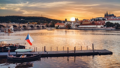 a boat is docked in the water near a bridge