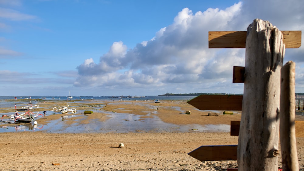 a beach with a bunch of boats in the water