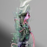 A complex and abstract digital sculpture featuring a blend of organic and geometric shapes. The piece incorporates smooth, flowing elements alongside precise, technical lines, creating a futuristic and intricate appearance. The structure is predominantly composed of glass-like textures interwoven with metallic and neon accents.