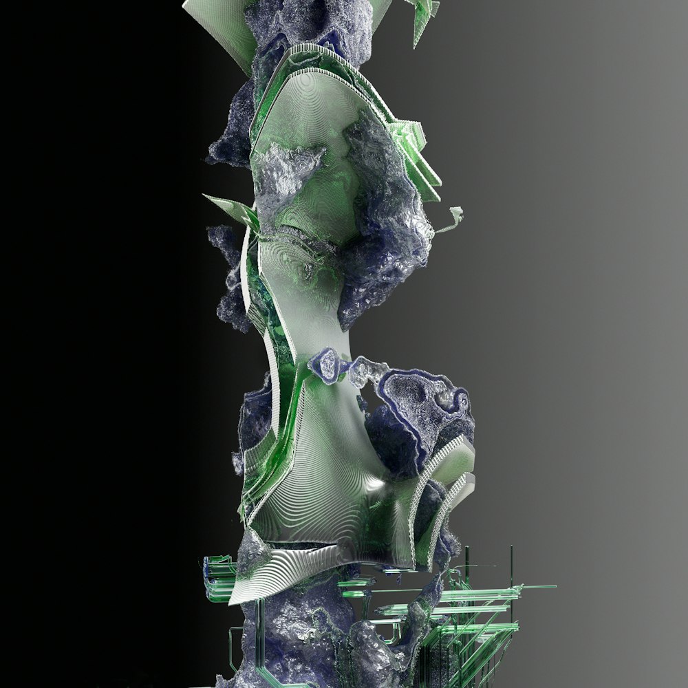 a sculpture of a woman's torso with green and blue accents