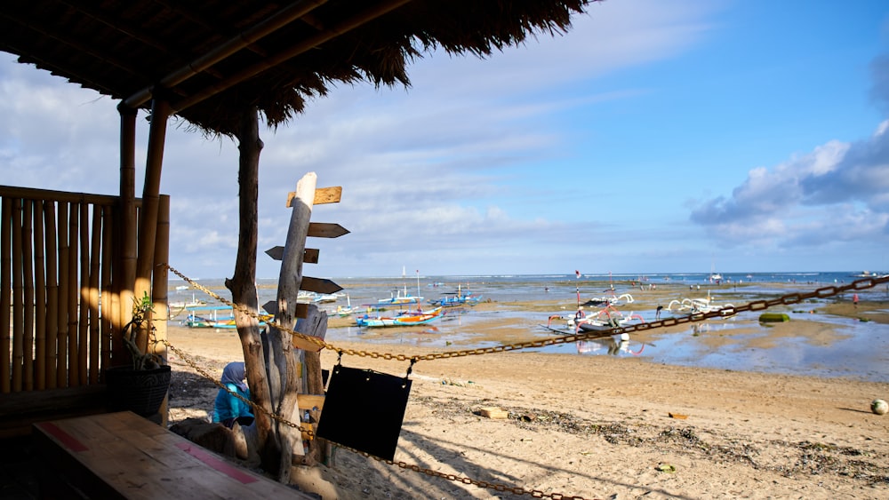 a beach with a bunch of boats in the water