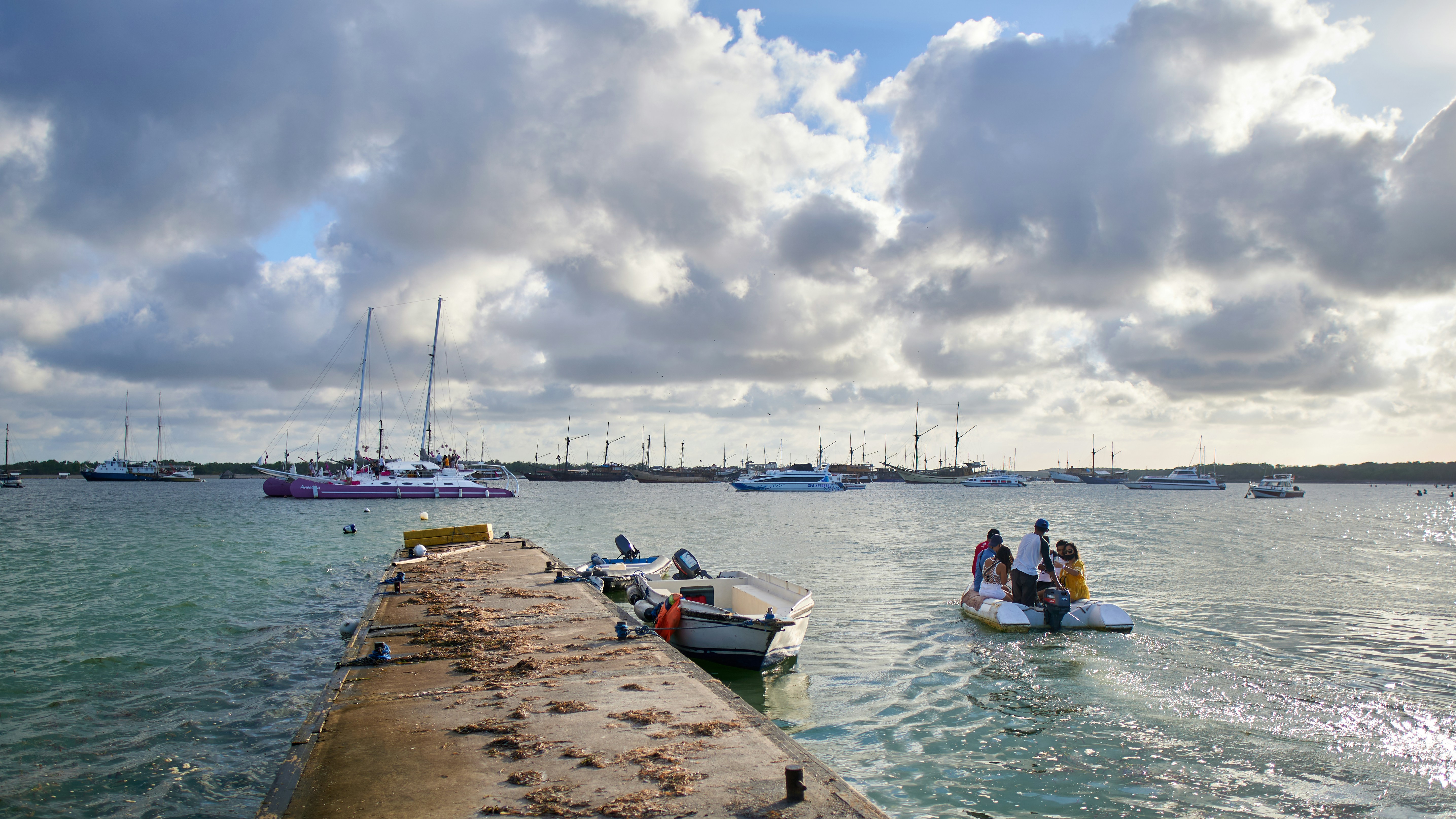 a group of people riding on the back of a boat