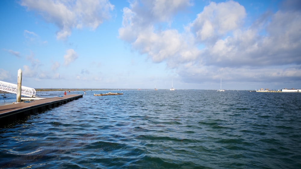 a body of water with boats in the distance