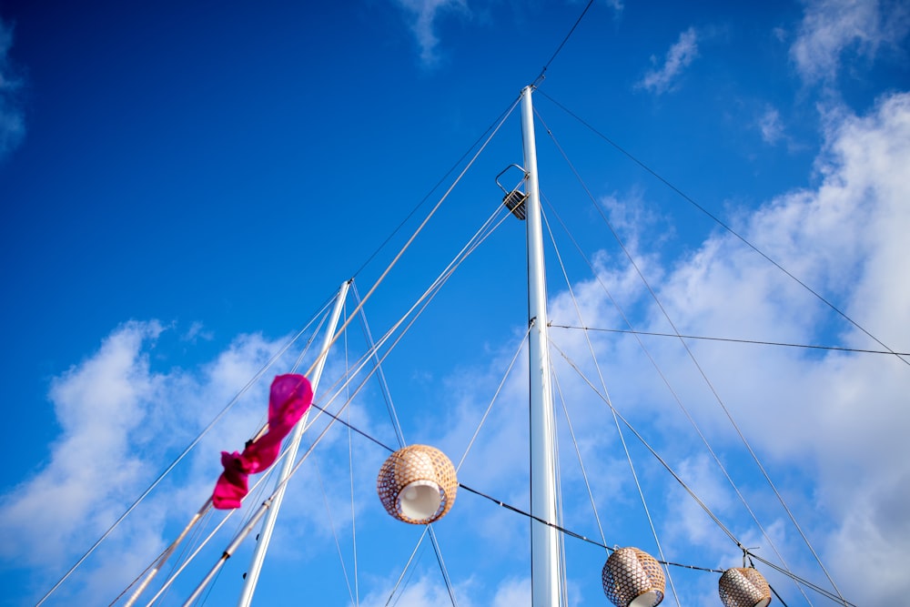 a bunch of balls hanging from the side of a boat