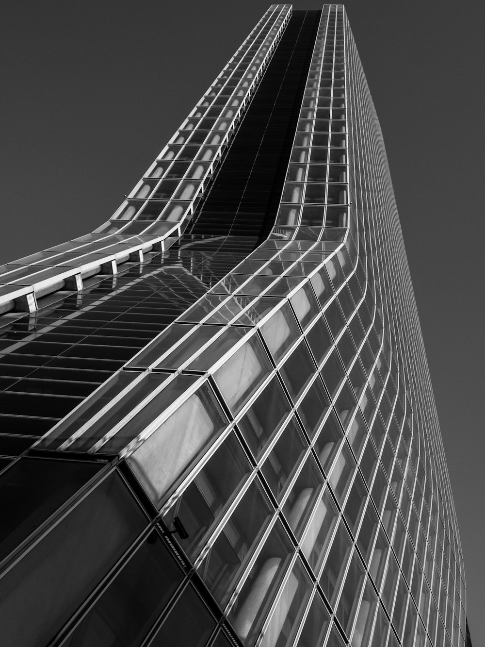 a black and white photo of a tall building