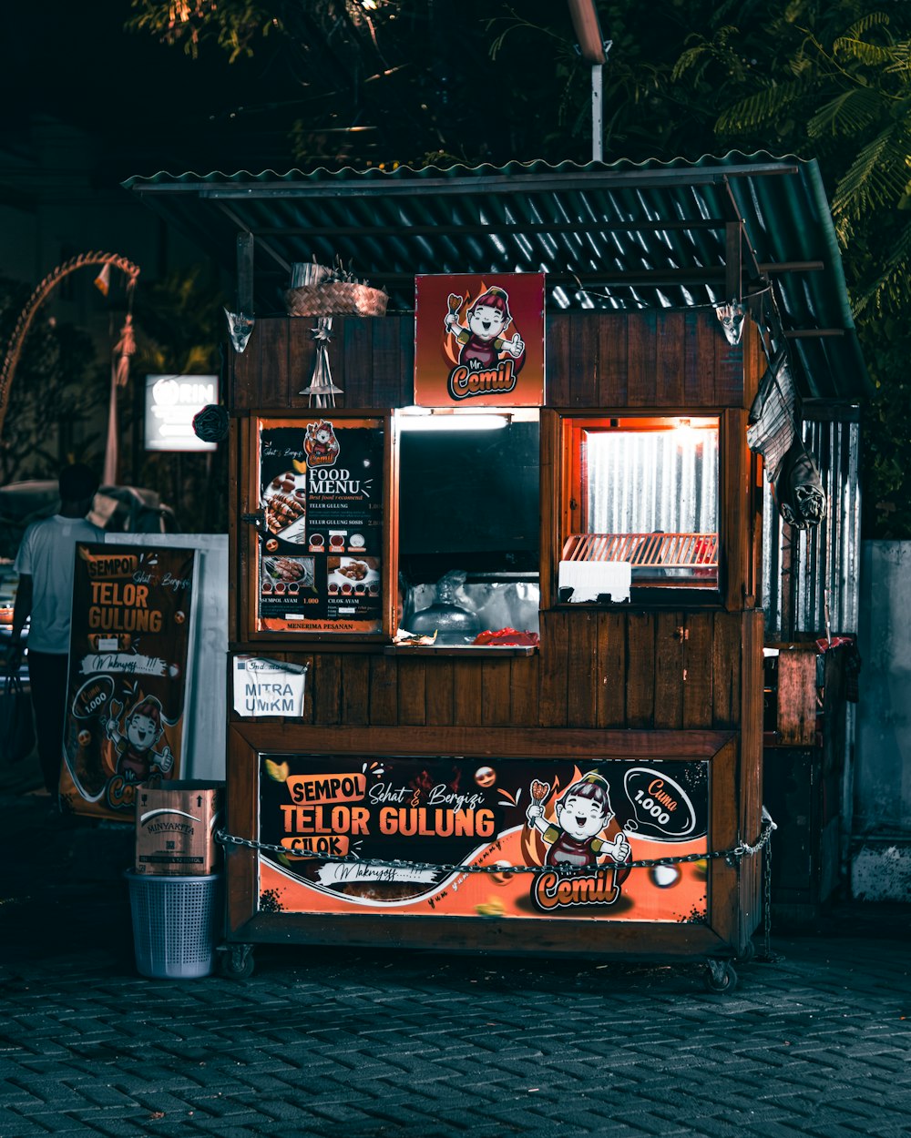 a food stand with a lot of signs on it