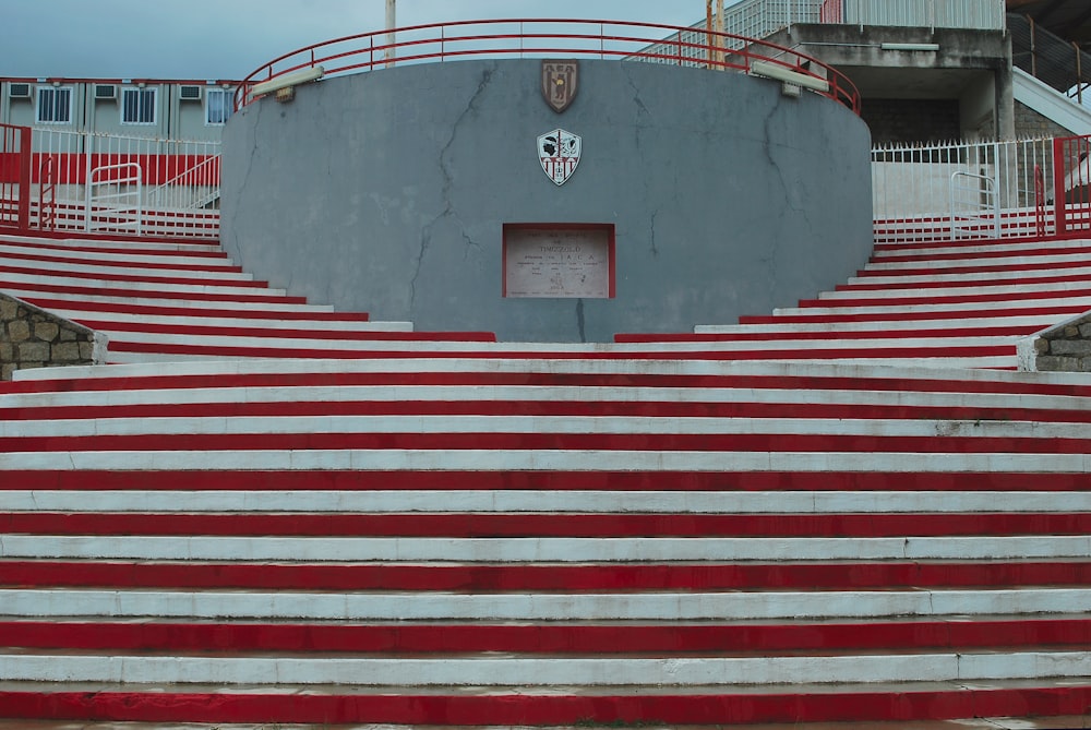 a large concrete structure with red and white steps