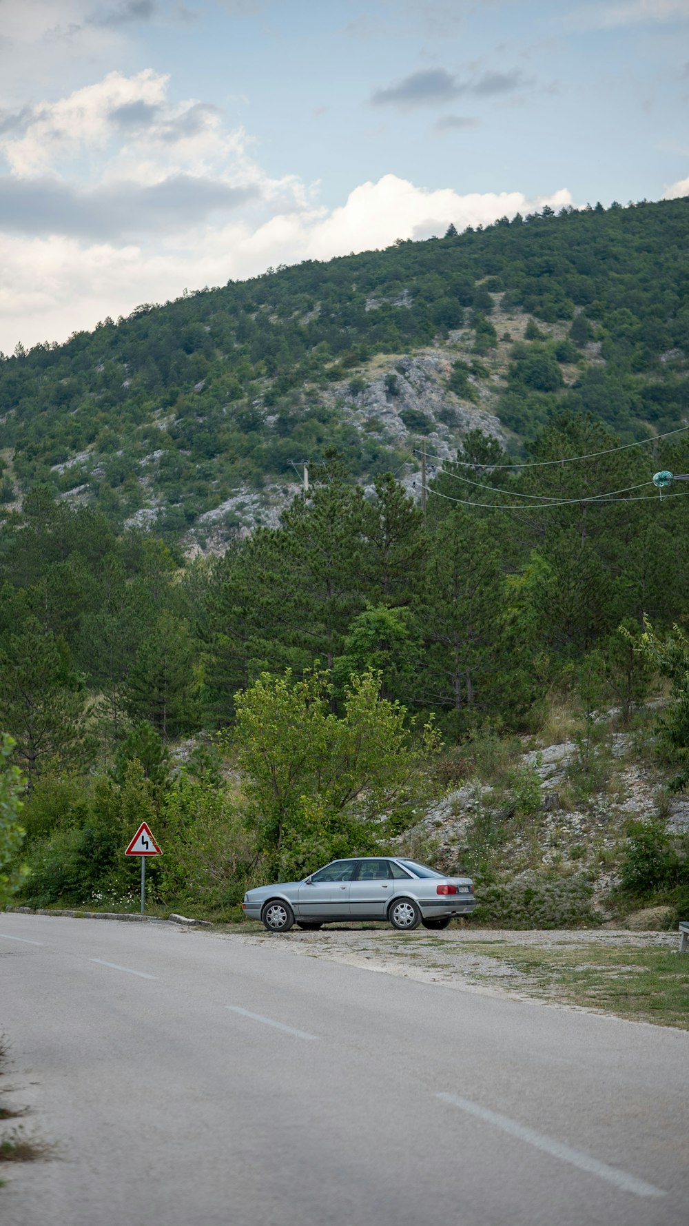 a car is parked on the side of the road