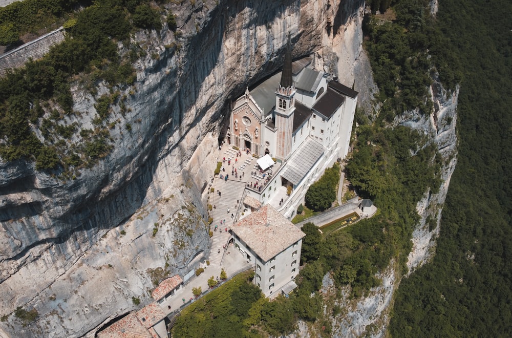 an aerial view of a building on a cliff