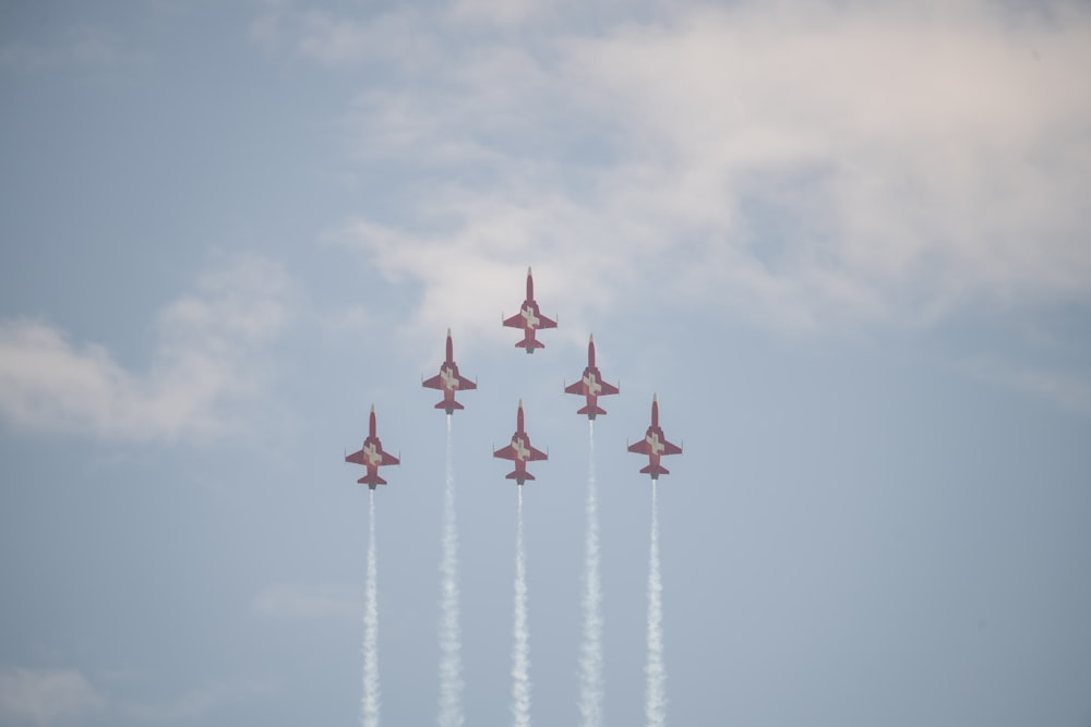 a group of fighter jets flying in formation