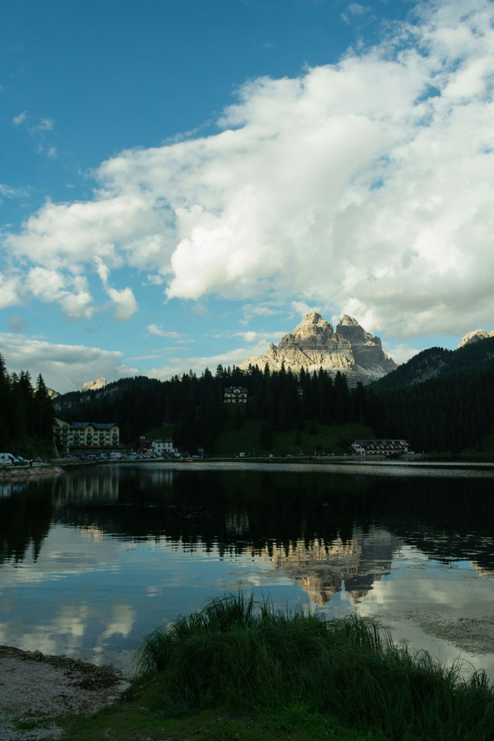 a body of water with a mountain in the background