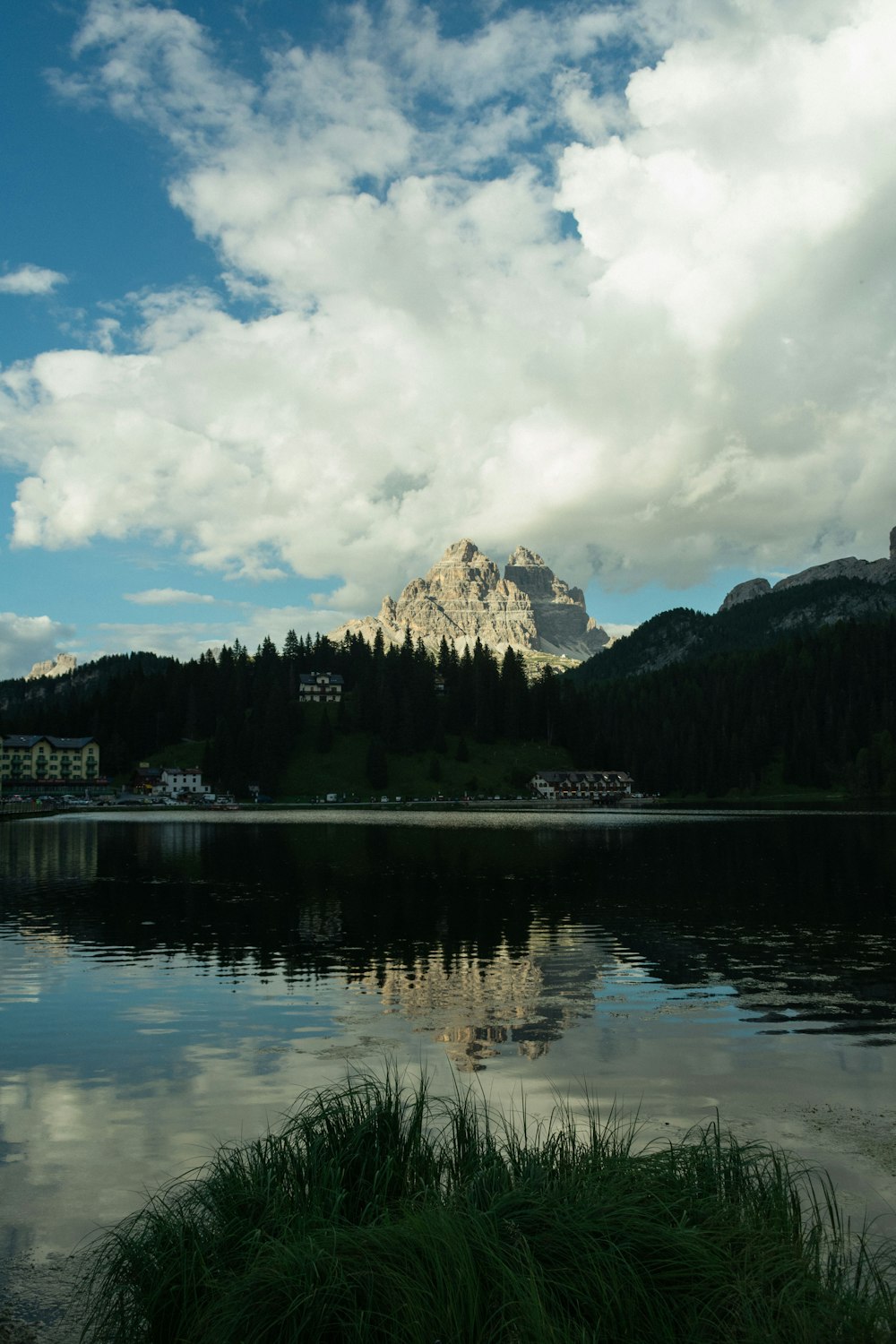 a large body of water with a mountain in the background