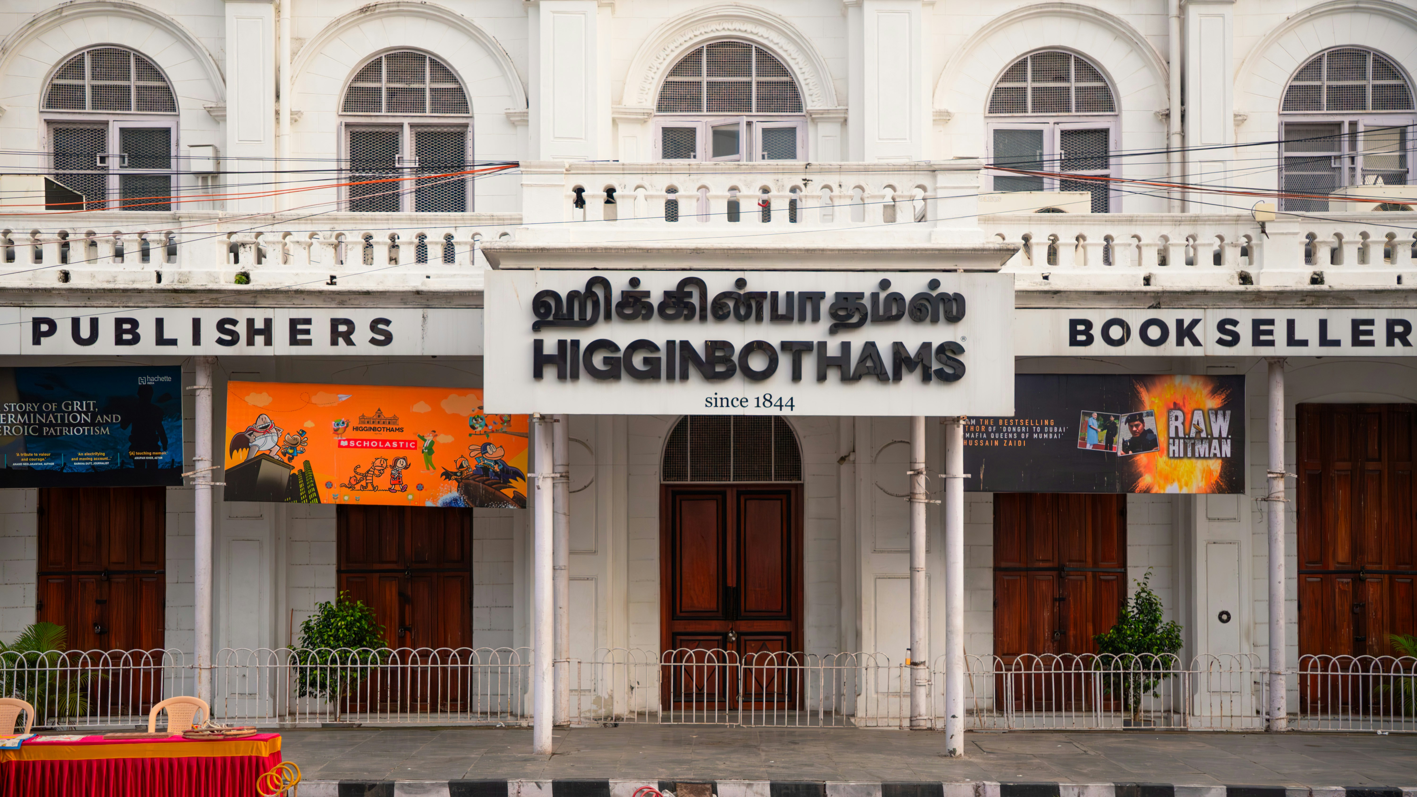 a large white building with a sign on the front of it