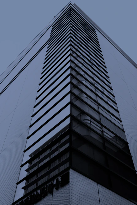 Sleek commercial building facade showcasing glass and concrete elements in a city setting