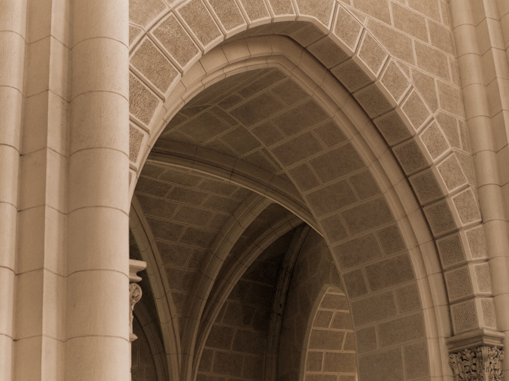 an arch in a building with a clock on it