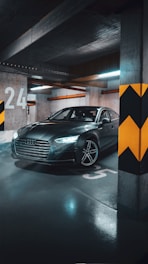 A modern car parked in a secure garage.