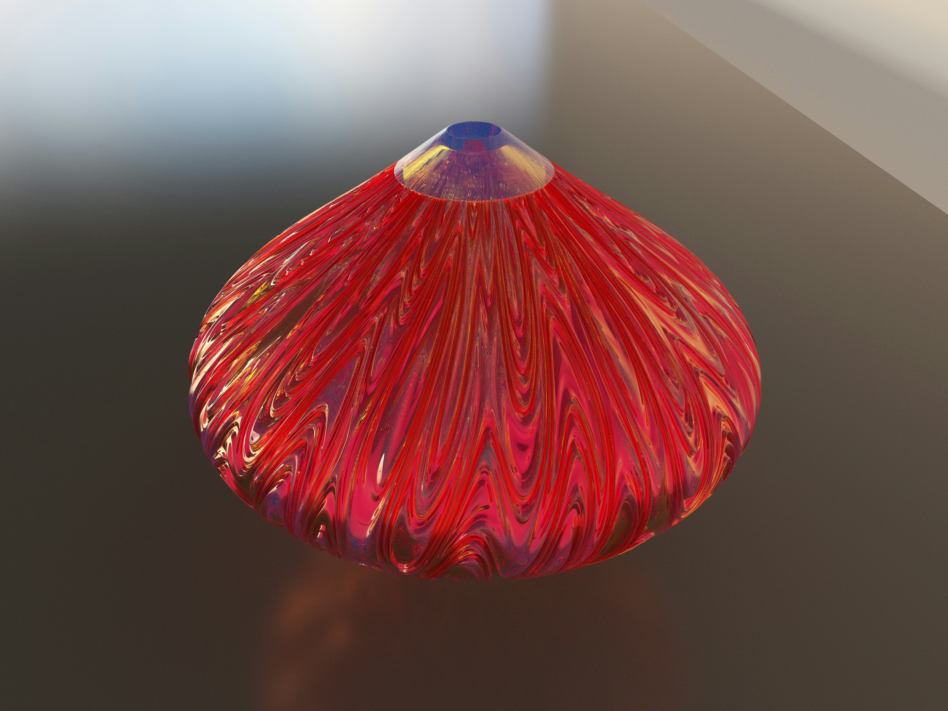 a red glass vase sitting on top of a table