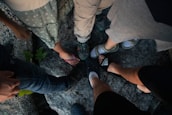 A diverse group of people enjoying outdoor activities while wearing comfortable shoes with herbal insoles.