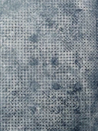 Hands fitting together irregular puzzle pieces over a bright, inviting surface.