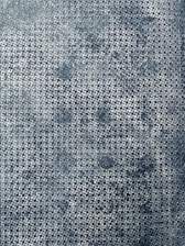 Close-up of interlocking puzzle pieces forming a precise pattern on a deep blue background.