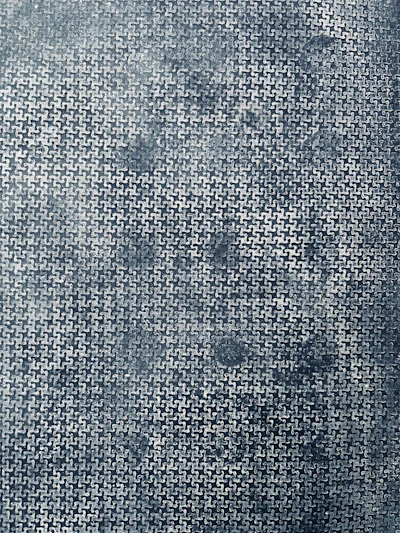 Close-up of black interlocking rubber gym tiles showing textured surface and edge connectors.