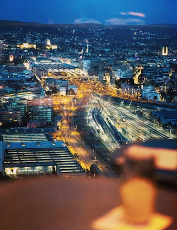 A panoramic view of a cityscape with overhead transit lines shining after a thorough cleaning.