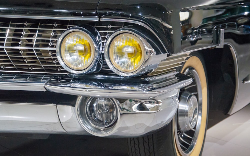 a close up of the front of a classic car