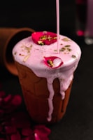 a pink drink with a straw sticking out of it