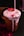 a pink drink with a straw sticking out of it