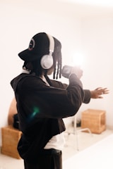 Modern EEG headset worn by a person in a clean, white room with soft natural light.