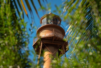 a tall tower with a clock on the top of it