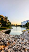 A welcoming office space with a view of a serene New Hampshire lake at sunset.