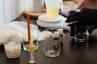 Artisanal perfume bottles and blending tools for a custom fragrance experience.