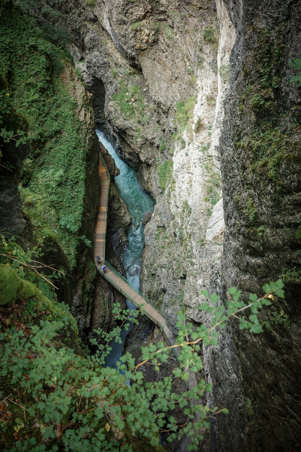 a long pipe running through a narrow canyon