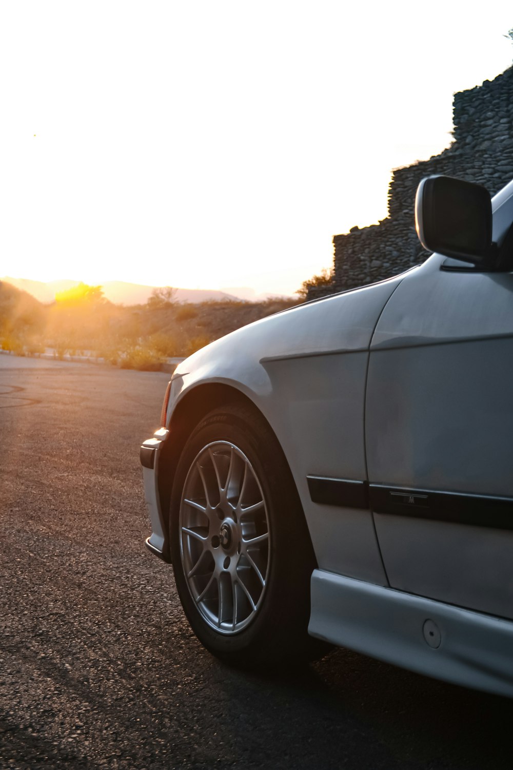 a white car parked on the side of the road