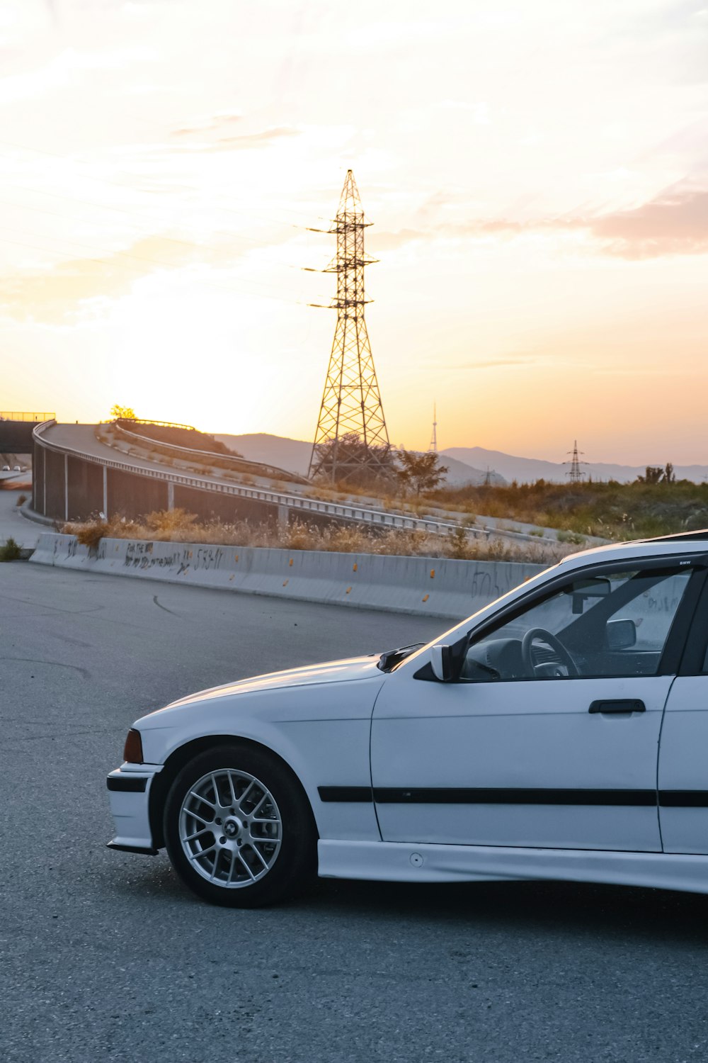 a white car parked in a parking lot