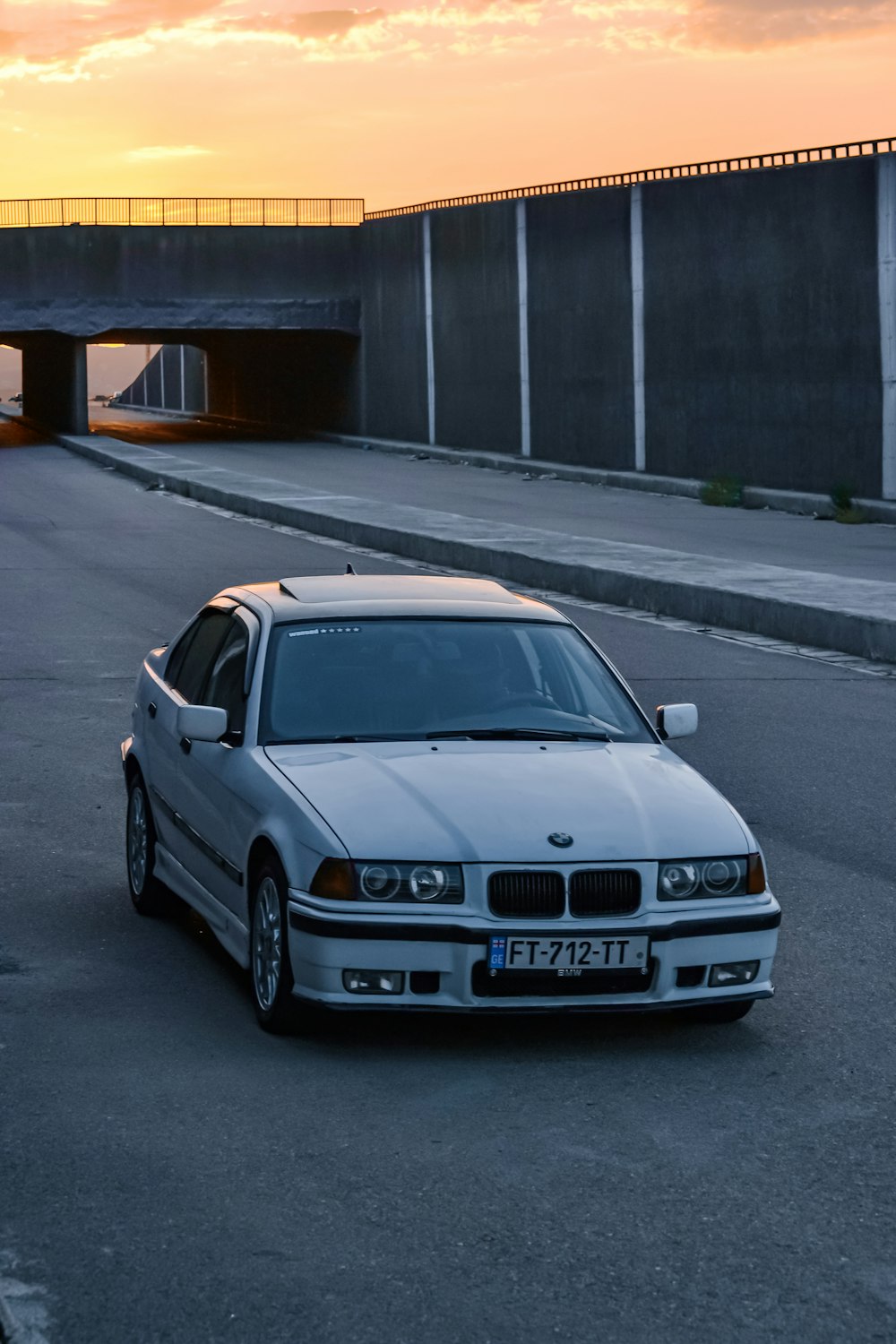 a white car parked on the side of the road