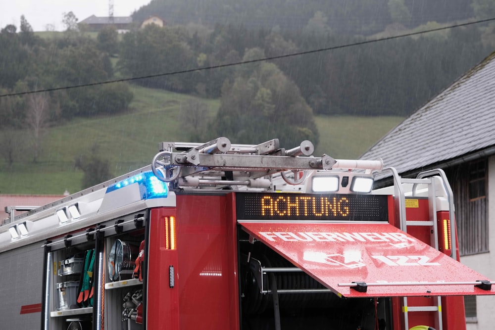 a red fire truck parked in front of a building