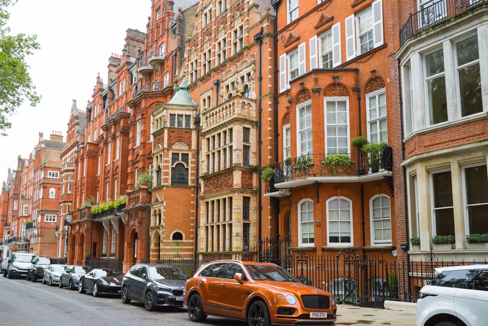 a row of orange brick buildings on a city street