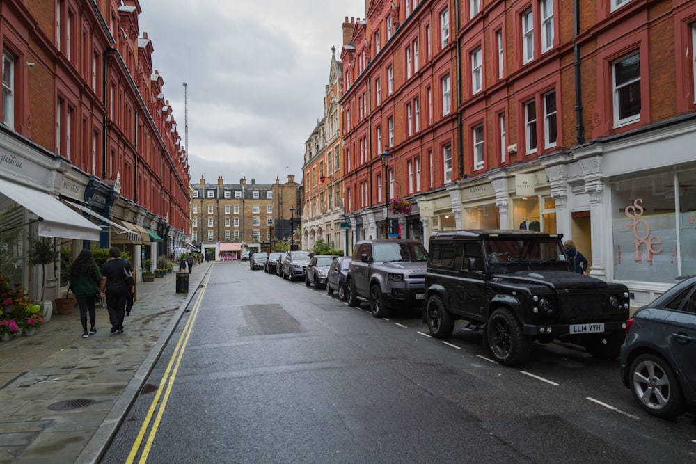 a row of cars parked on the side of a street