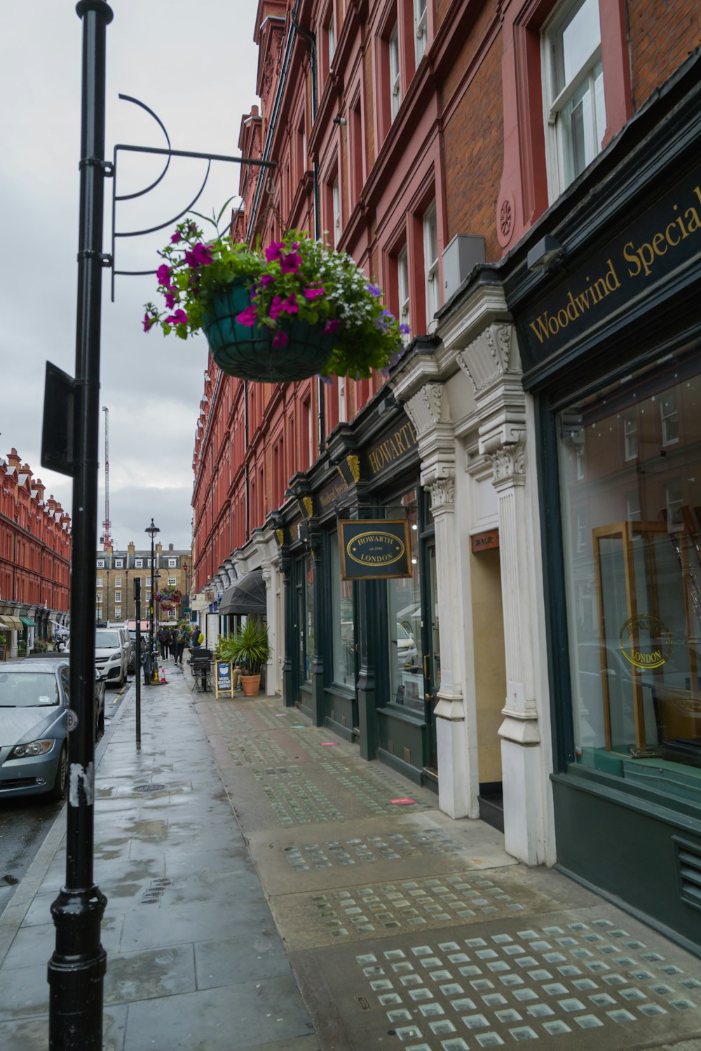 a city street with cars parked on the side of it