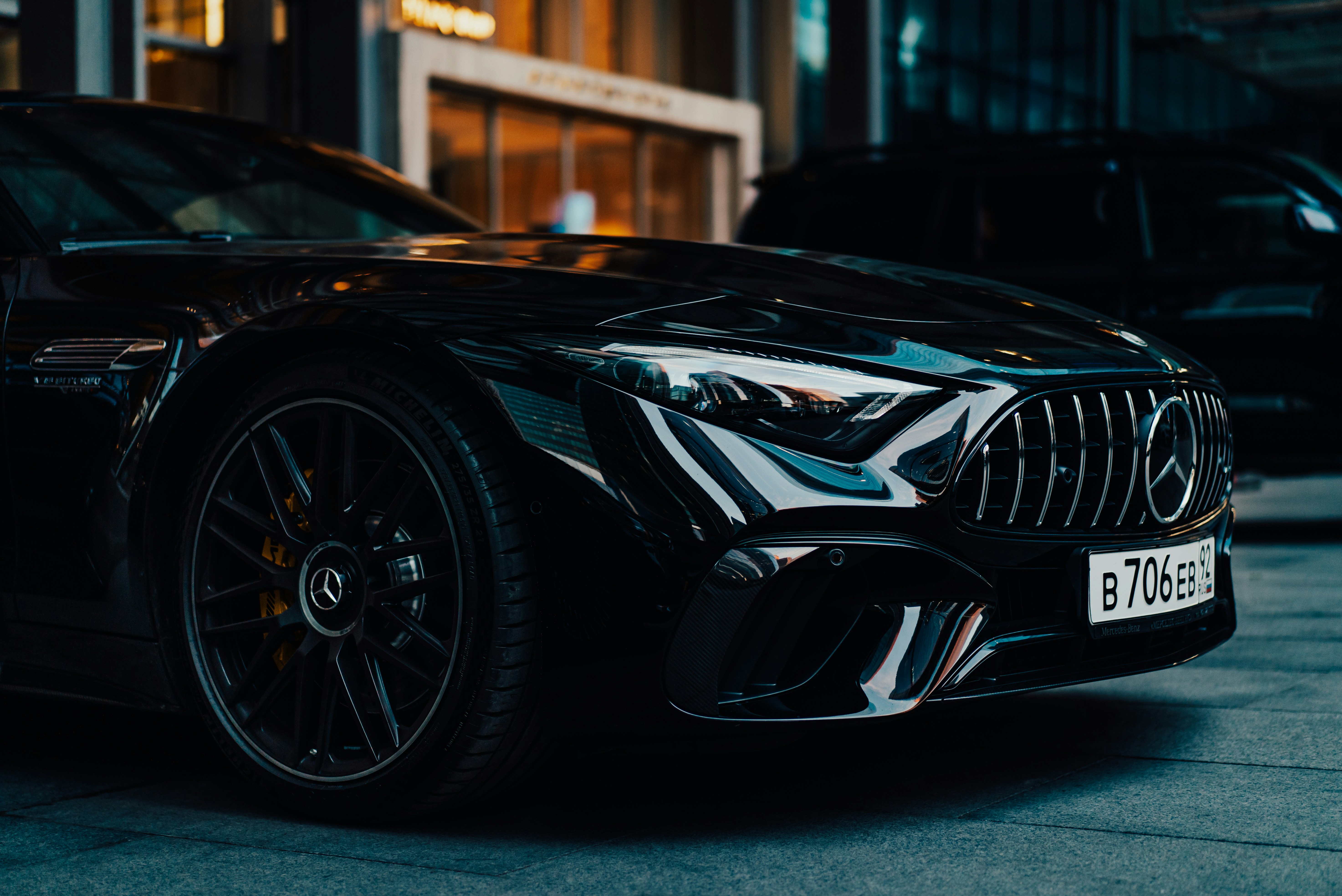 a black car parked in front of a building