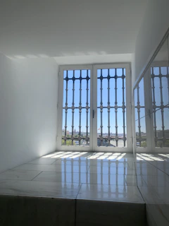 Before and after image of an end of lease cleaning showcasing sparkling floors and windows.