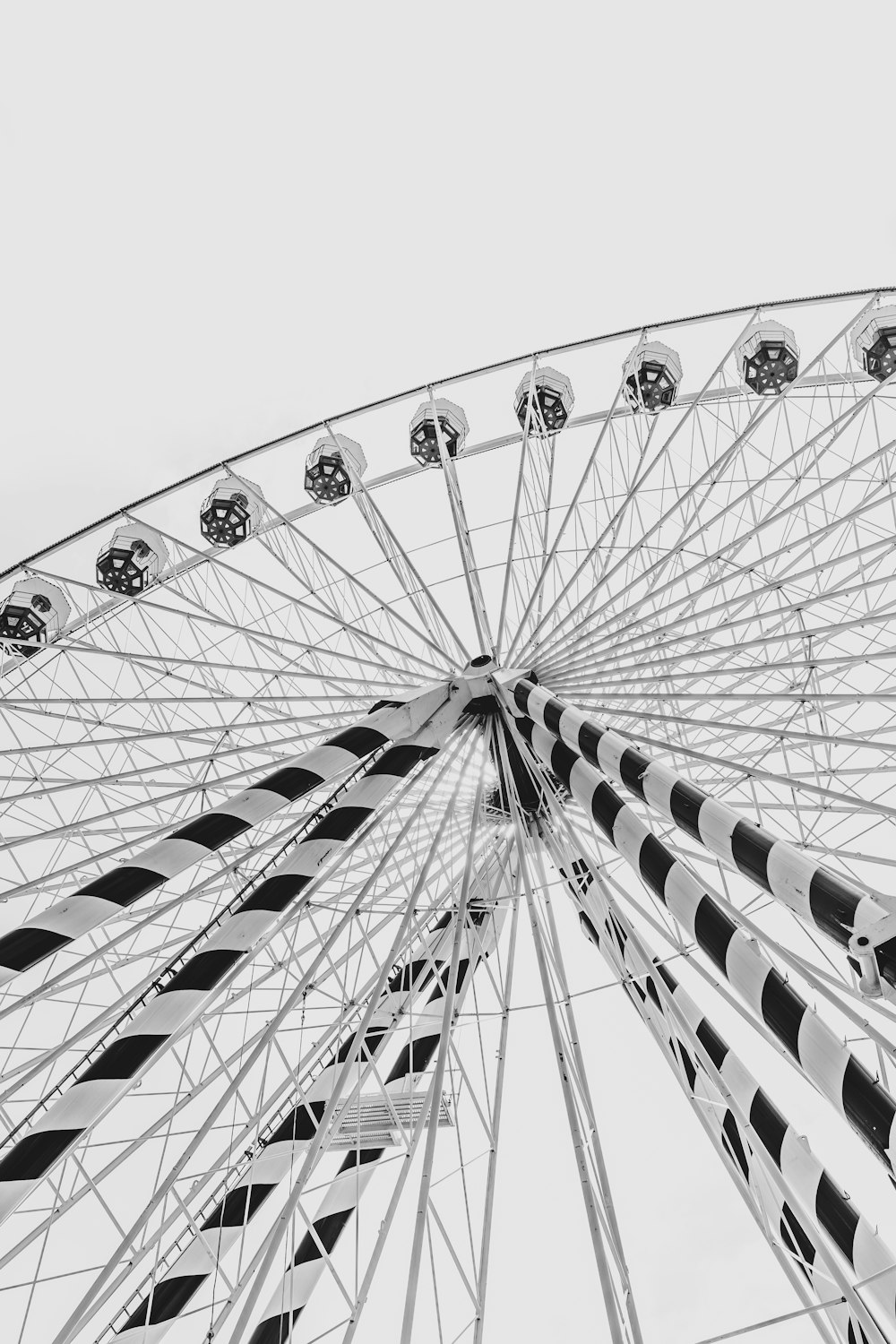 a black and white photo of a ferris wheel