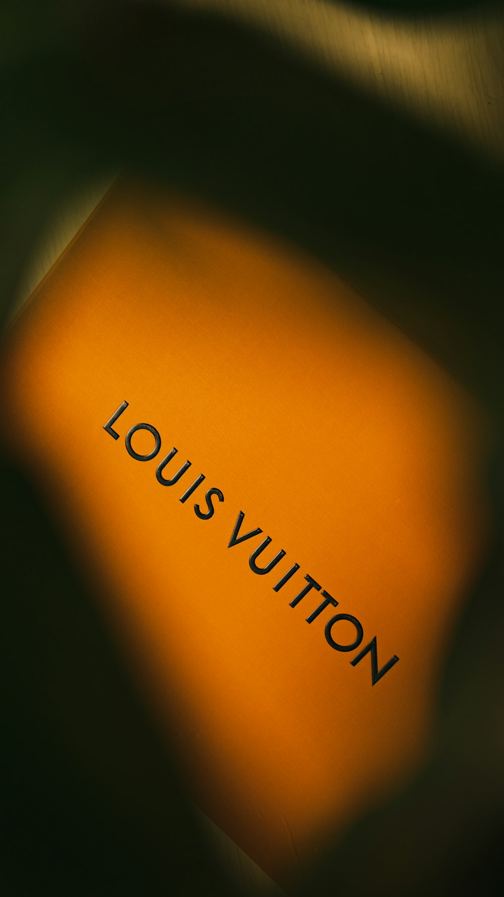 a close up of a book with the word louis vutton on it