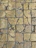 Close-up of weathered European flagstone with natural patina and subtle color variations.