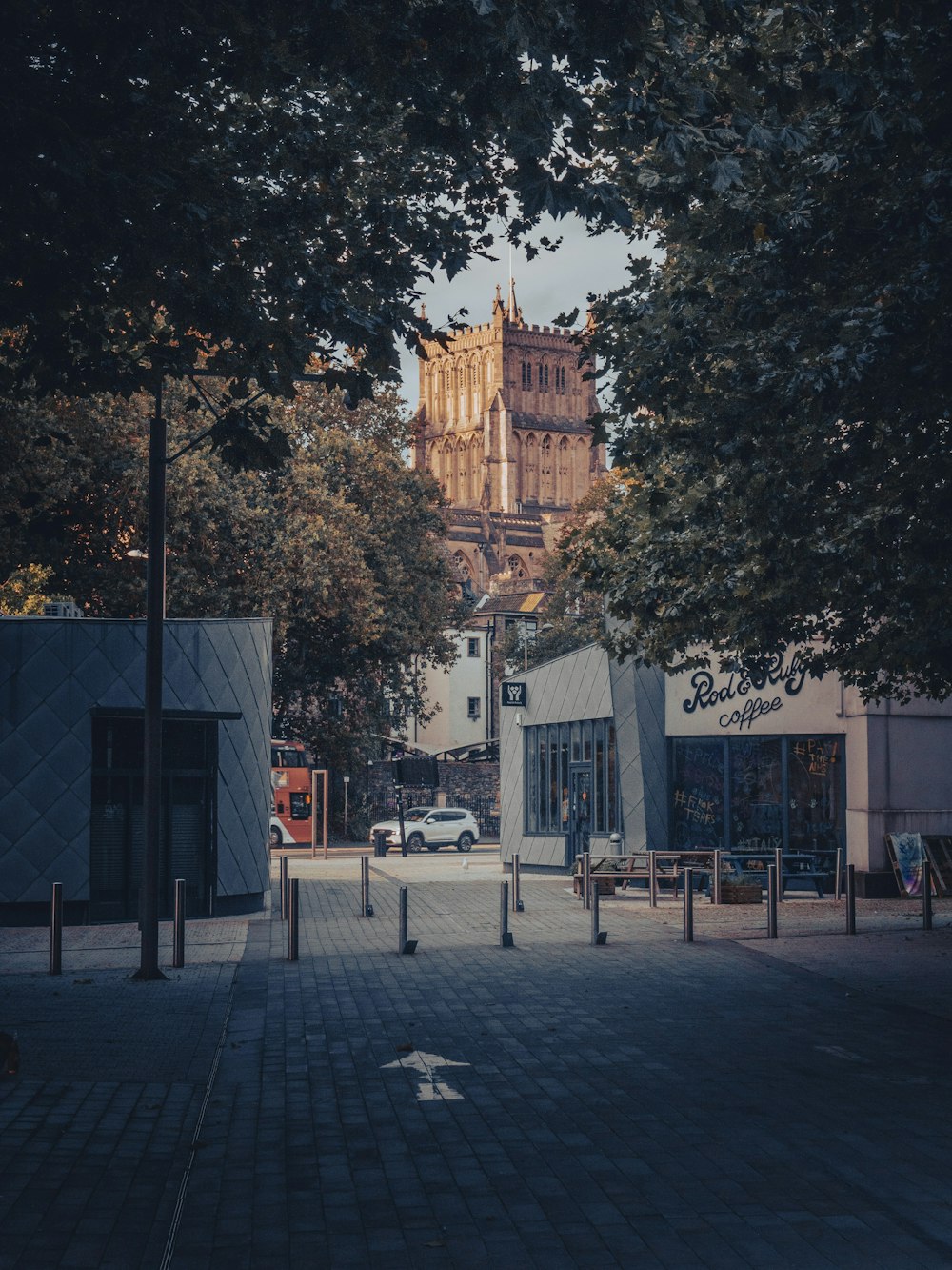 a city street with a clock tower in the background